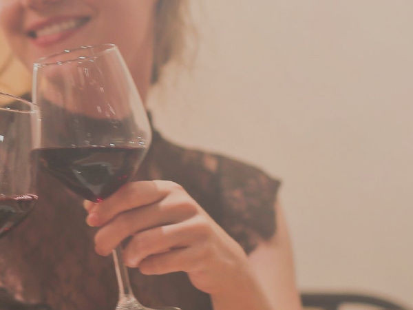 Woman celebrating with a glass of wine